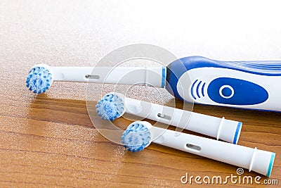 Electronic toothbrush with toothbrush heads on white Stock Photo