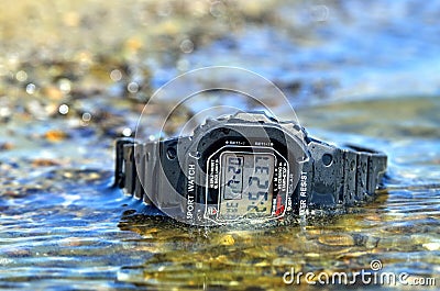 Electronic waterproof watch, immersed in the water stream Stock Photo