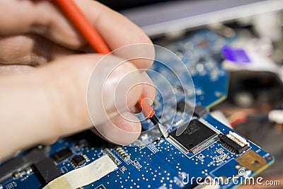 Electronics repair close-up. Laptop service. Stock Photo