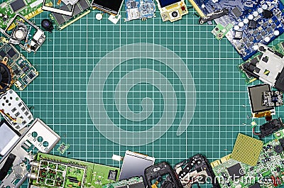 Electronics worker`s workplace, top view with disassembled electronics components, empty space for text in the center Stock Photo
