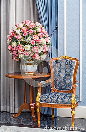 Elegance armchair with beautiful flower bouquet Stock Photo