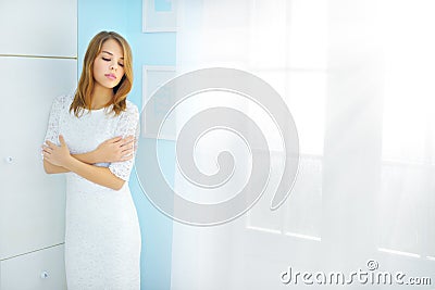 Elegance girl at the window Stock Photo