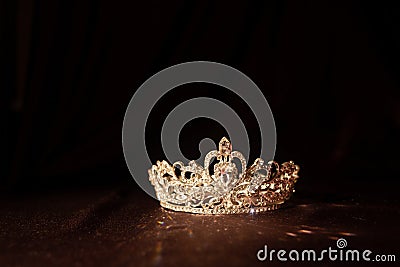 Elegance luxury royal crown on satin, silk background. Queen Stock Photo