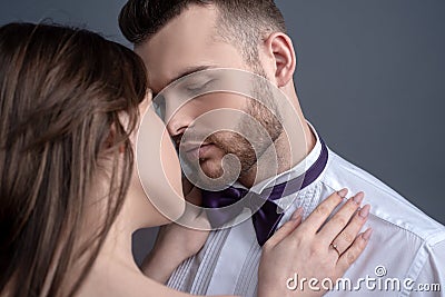 Elegand couple kissing. Touching body ecstasy and pleasure. Making love to young lover. Face sensual concept. Sensual Stock Photo