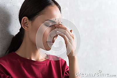 Elegant asian girl is feeling indisposition Stock Photo