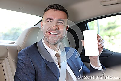 Elegant back seat passenger showing screen Stock Photo