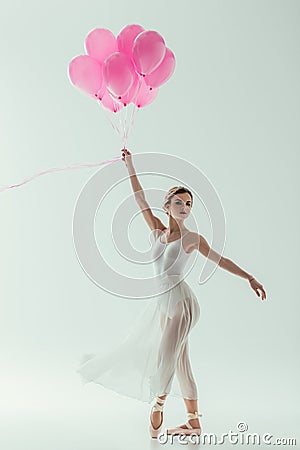 elegant ballerina with pink balloons Stock Photo