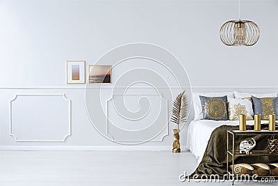 Elegant bedroom with golden decorations Stock Photo