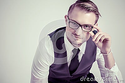 Elegant business man with glasses reflects concentrated Stock Photo