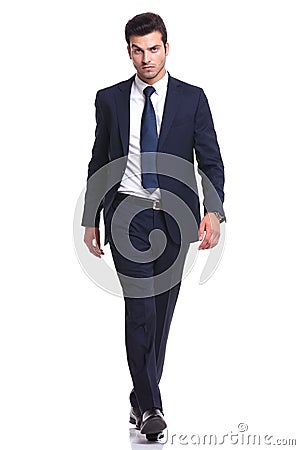 Elegant business man walking on white background Stock Photo