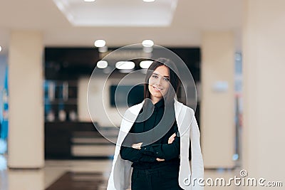 Elegant Businesswoman Casually Wearing Jacket on Shoulders Stock Photo