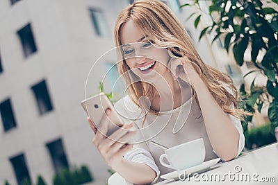 Elegant charming stylish woman using wifi for video call with he Stock Photo