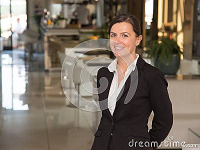 Elegant and cheerful woman receptionist Stock Photo