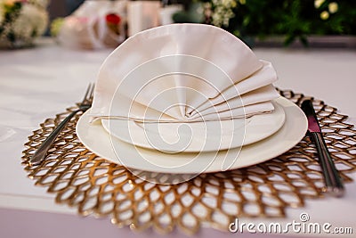 Elegant and chic gold and white table setting. selective focus Stock Photo