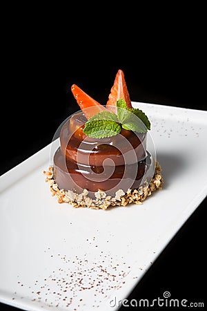 Elegant chocolate cake decorated with mint Stock Photo