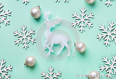 Elegant Christmas New Year Greeting Card Poster White Reindeer Snow Flakes Balls Pattern on Turquoise Blue Background. Stock Photo