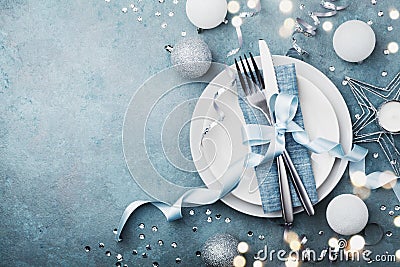 Elegant christmas table setting for holiday dinner top view. Empty space for text. Bokeh effect. Stock Photo