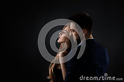 Elegant couple on black background. Stock Photo