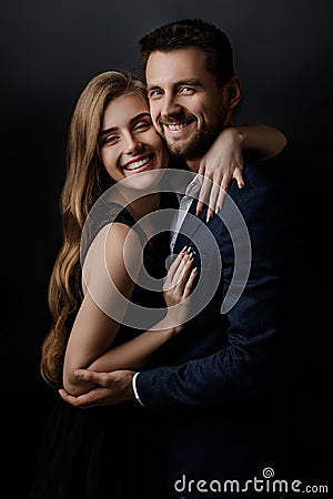 Elegant couple on black background. Stock Photo