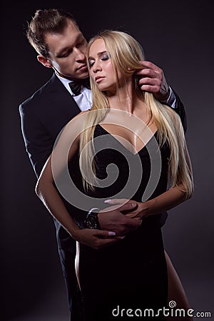 Elegant couple in love in a passionate embrace Stock Photo
