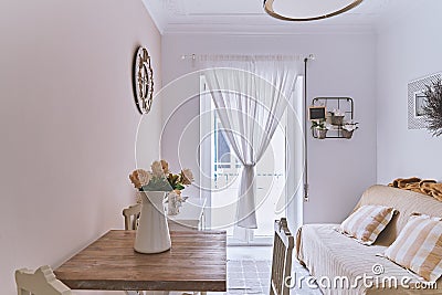 Cozy living room with an open balcony window and home decoration Stock Photo