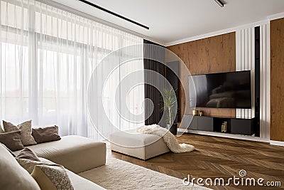 Elegant designed living room with wooden elements Stock Photo