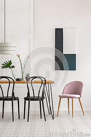 Elegant room interior with wooden chairs and green plants Stock Photo