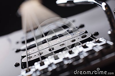 Elegant electric guitar close up point of view from bridge to neck Stock Photo