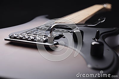 Elegant electric guitar on black background close up point of view showing large part from body Stock Photo