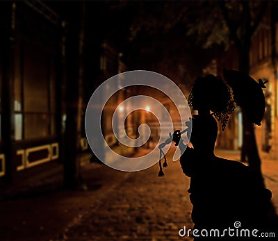 Elegant english lady walking down the streets of great britain a retro concept of the 19th century in England Stock Photo