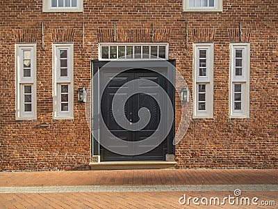 Elegant entrance front door with two windows Stock Photo