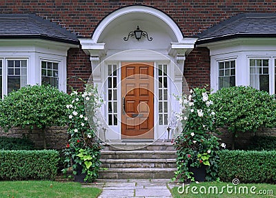 Elegant entrance with wood grain door Stock Photo