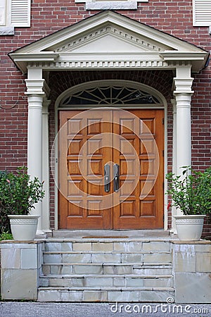 Elegant entrance with wood grain double door Stock Photo