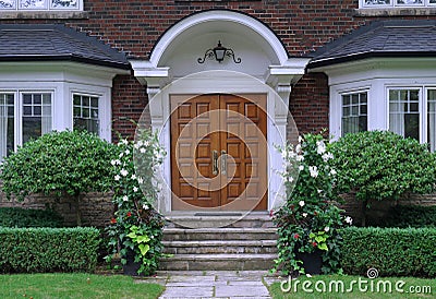 Elegant entrance with wood grain double door Stock Photo