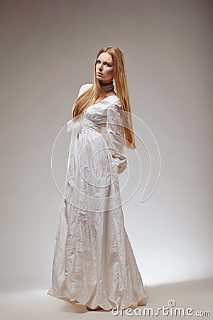 Elegant fashion woman in medieval era dress. Stock Photo