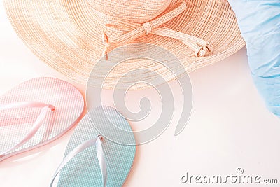 Elegant Female Straw Hat Blue Slippers Beach Wrap on White Background Golden Pink Flare Pastel Colors Summer Vacation Stock Photo