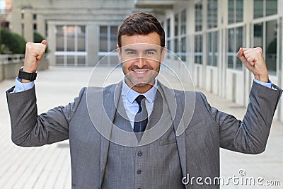 Elegant funny businessman flexing his muscles Stock Photo
