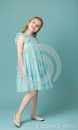 Elegant girl in a dress. Youth fashion concept, happy child. Stock Photo