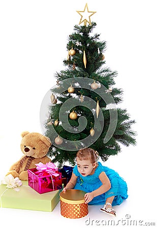 Elegant girl near the Christmas tree Stock Photo