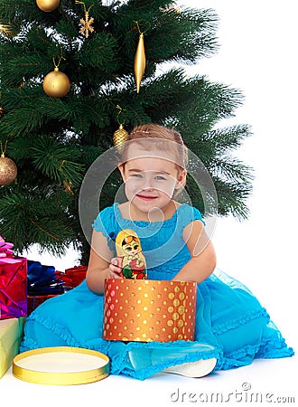 Elegant girl near the Christmas tree Stock Photo