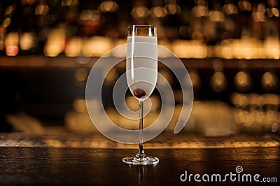 Elegant glass of fresh French 75 cocktail with cherry Stock Photo