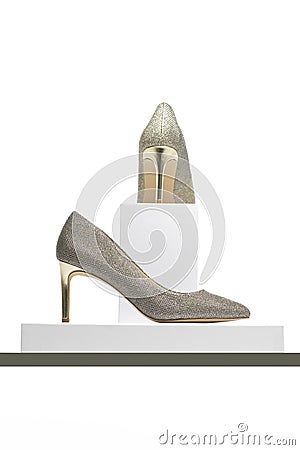 Elegant high heeled silver ladies shoes on display Stock Photo