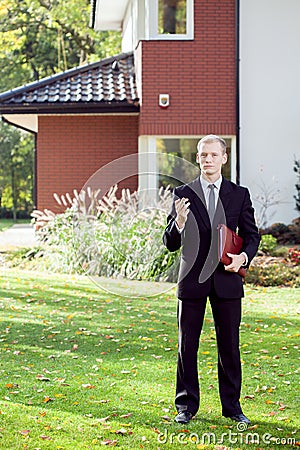 Elegant house agent wearing suit Stock Photo
