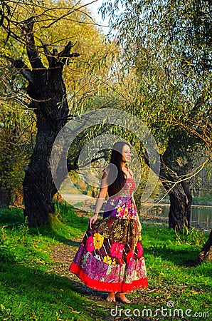 Elegant lady standing in the forest Stock Photo