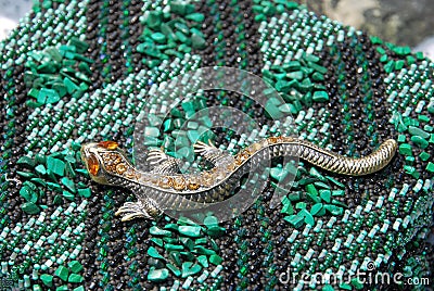 Elegant lizard - a symbol of the Mistress of Copper Mountain Editorial Stock Photo