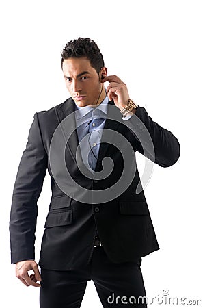 Elegant man ressed as bodyguard or security agent Stock Photo