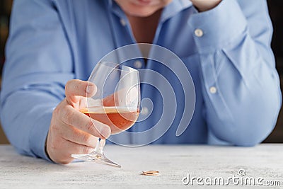 Elegant man suffering from alcoholism drinking whisky Stock Photo