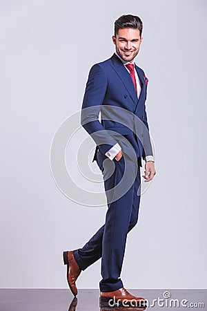 Elegant man walking away whith hand in pocket Stock Photo