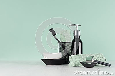 Elegant men dressing table in trend green mint menthe color - black razor, toothbrush, soap, towel, dispenser on light white wood Stock Photo