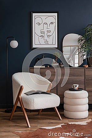 Elegant modern living room interior design with fluffy armchair, pouf, wooden commode, mock up poster frame. Copy space. Stock Photo